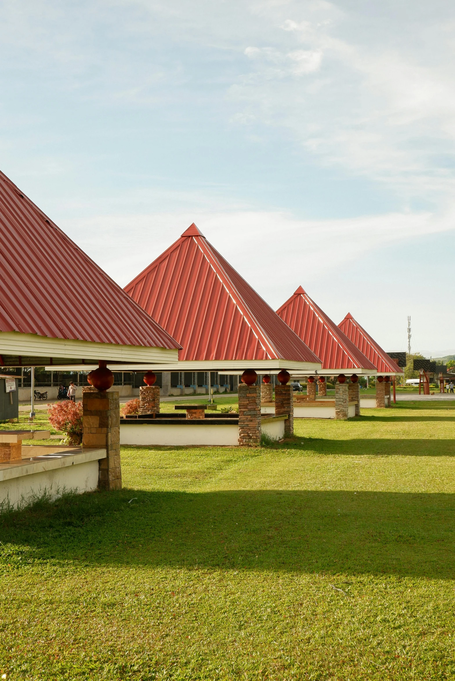 a line of houses with red tiled roofs