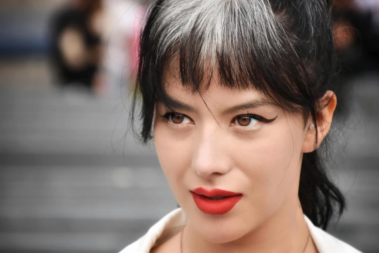 a close up po of a woman wearing red lipstick