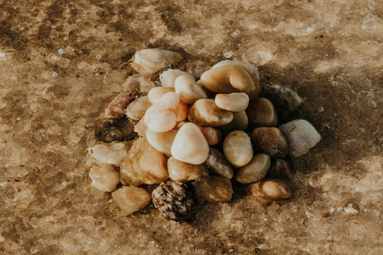 many rocks that are on the ground next to each other