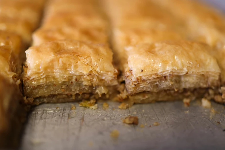 a group of pastries sitting on top of a wooden counter