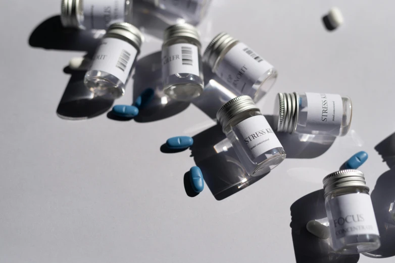 a group of medicine bottles on white table