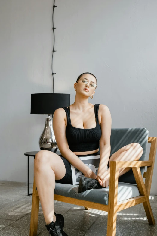 a woman that is sitting on a chair