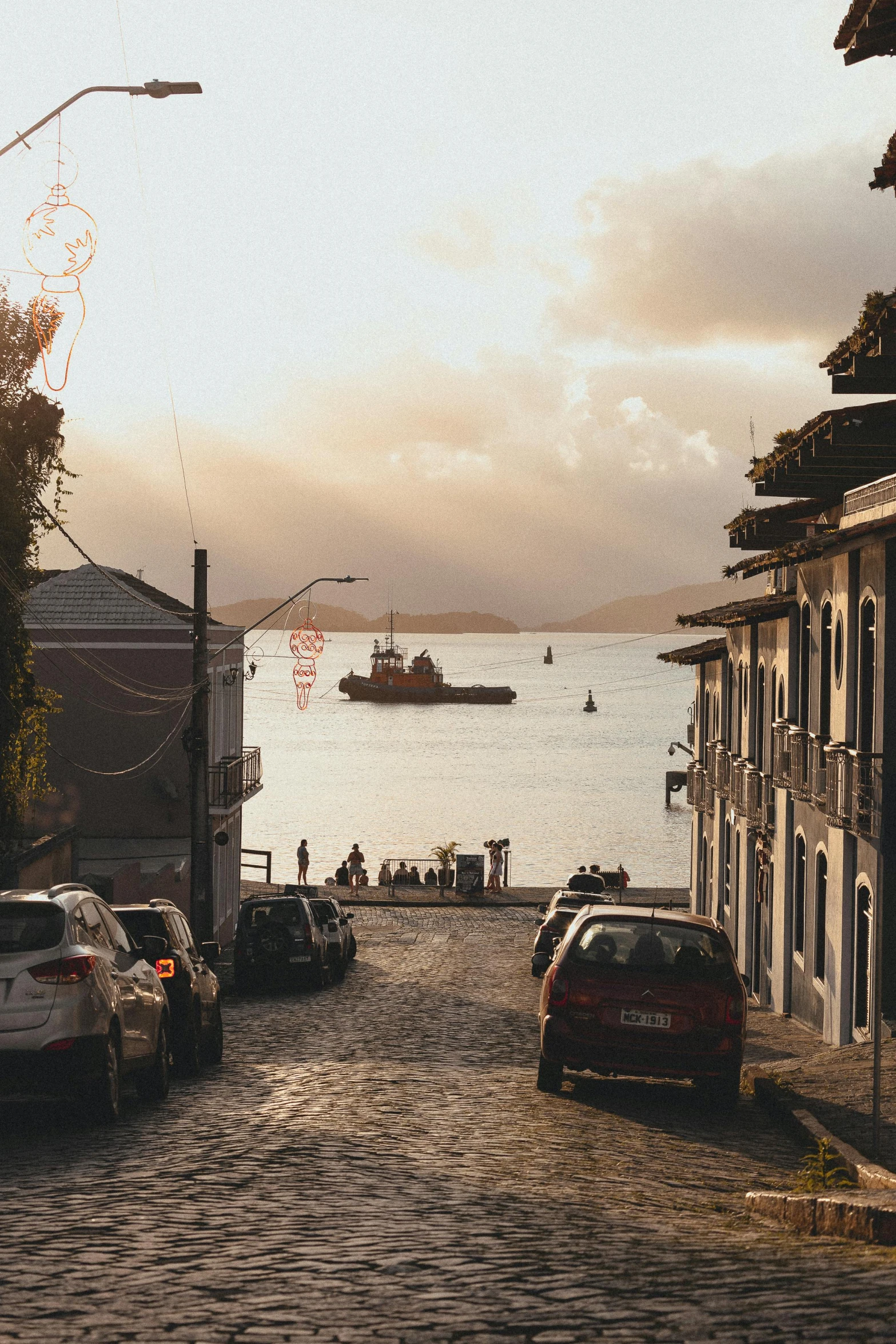 a cobbled stone road leads to a marina