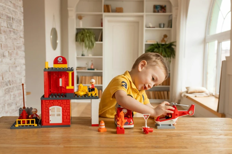 a young child playing with a set of toys