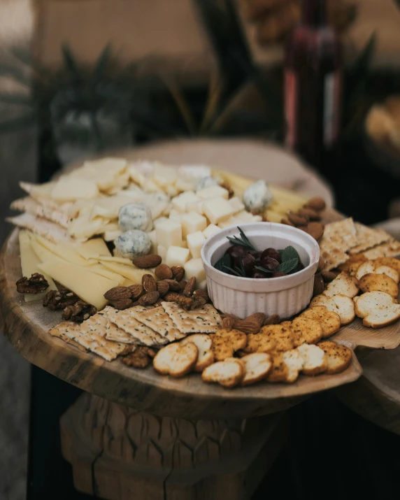 several types of cheeses and ers on a table