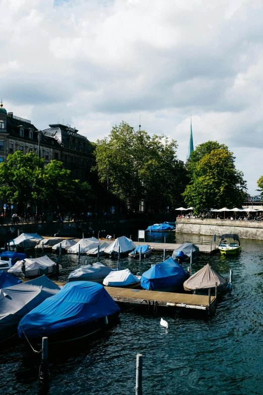 a dock filled with lots of water and small boats