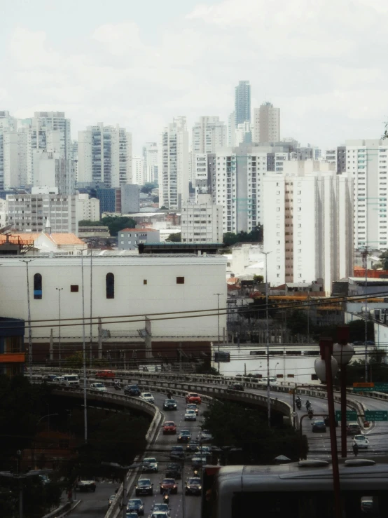 a city filled with traffic and lots of tall buildings