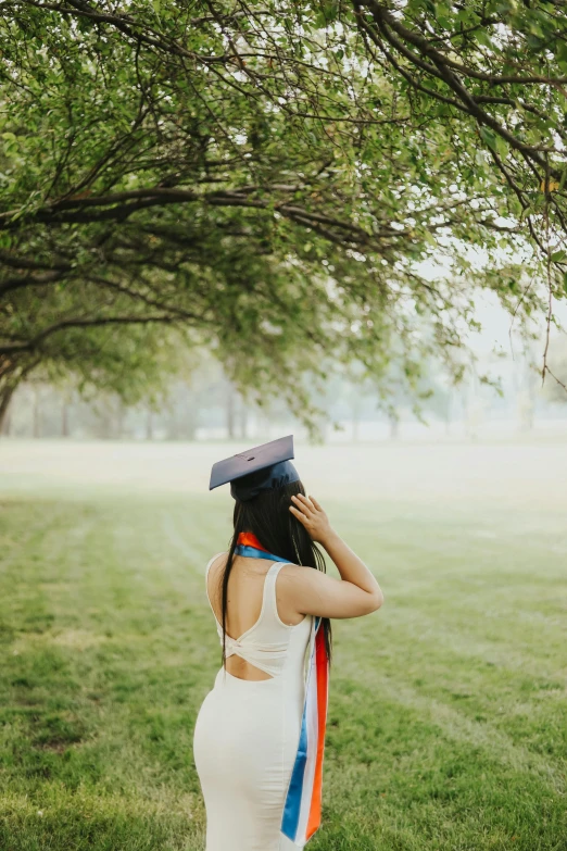 a girl in a dress with a hat on her head