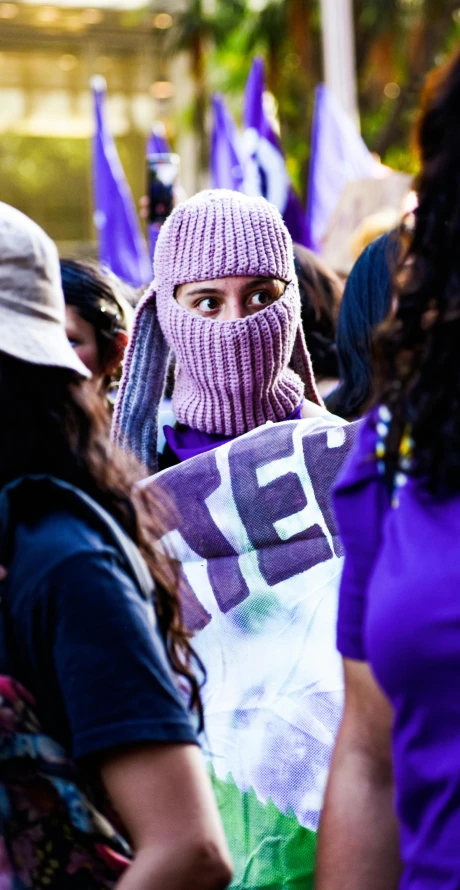 a person in purple with their head covering