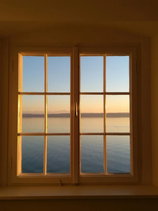 the view out of a window on the ocean