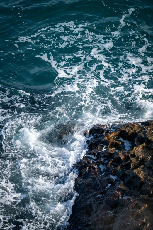 a body of water next to a rocky beach