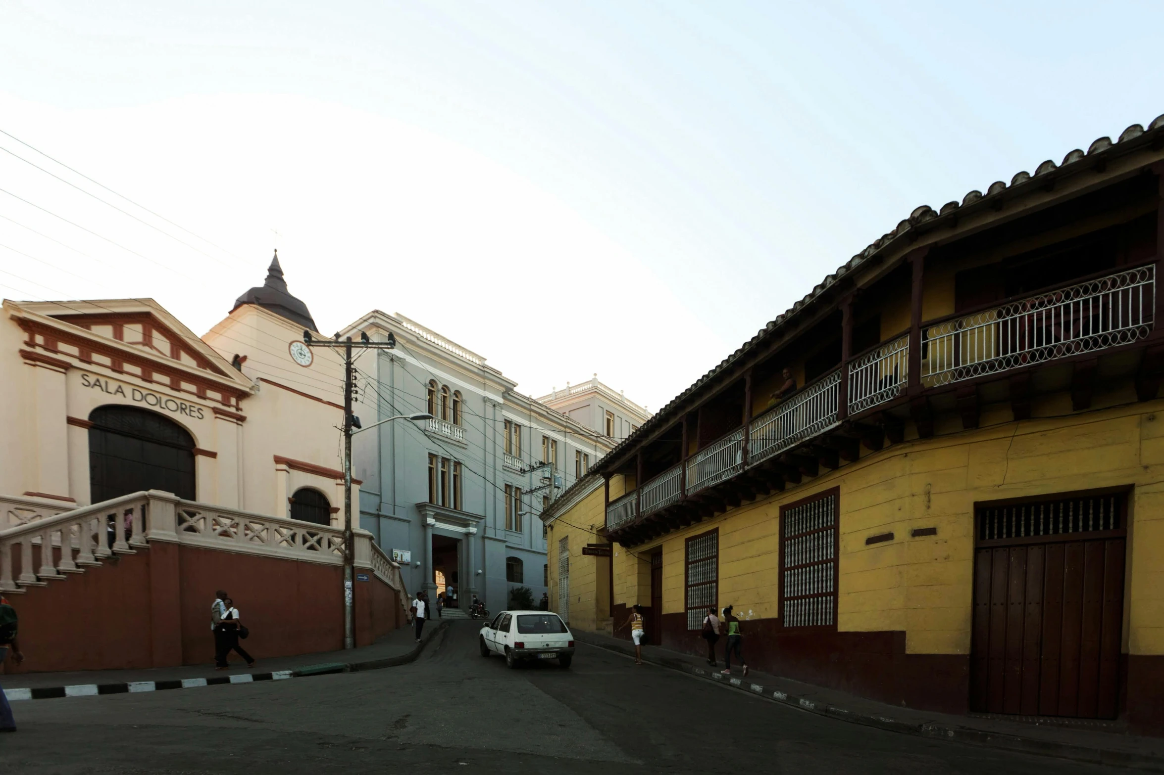 two people are walking by the streets of a city