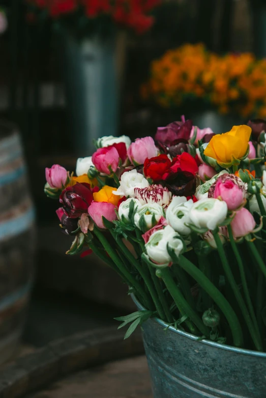 flowers in a bucket and other flower pots