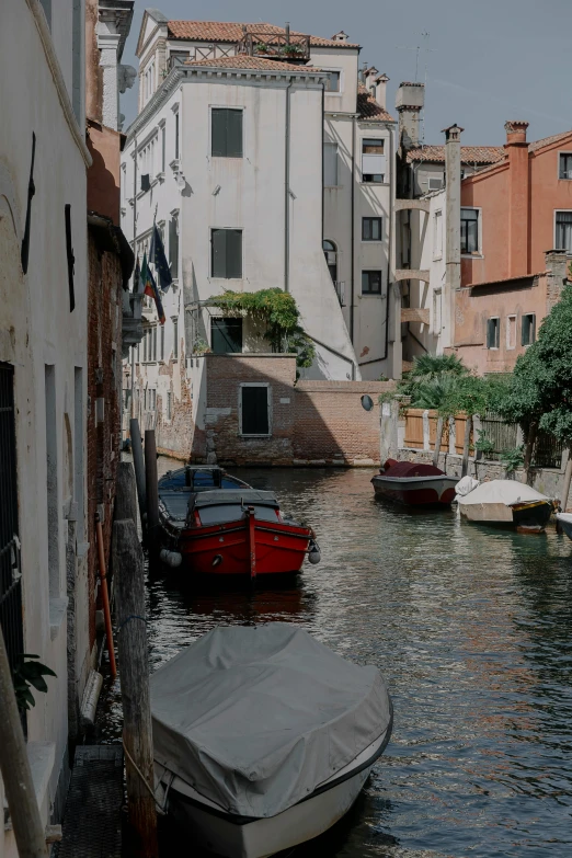 a waterway is filled with boats and houses