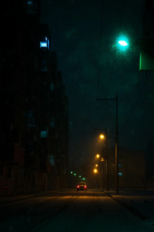 a rainy night in an urban area with buildings lit up