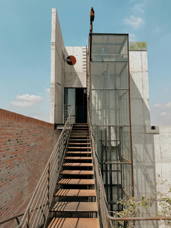 a bunch of stairs are going down the side of a building