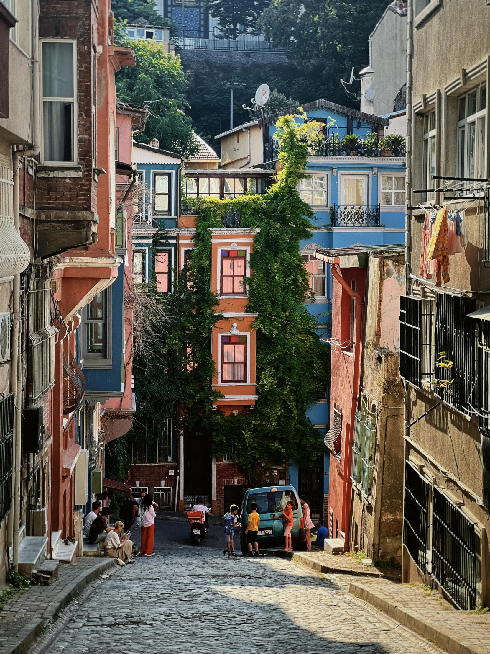 a narrow street lined with red buildings