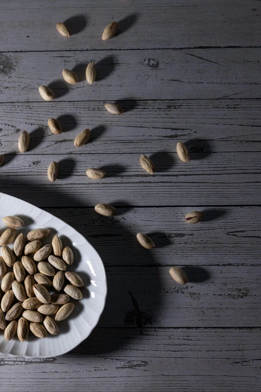 several nuts are scattered on a plate