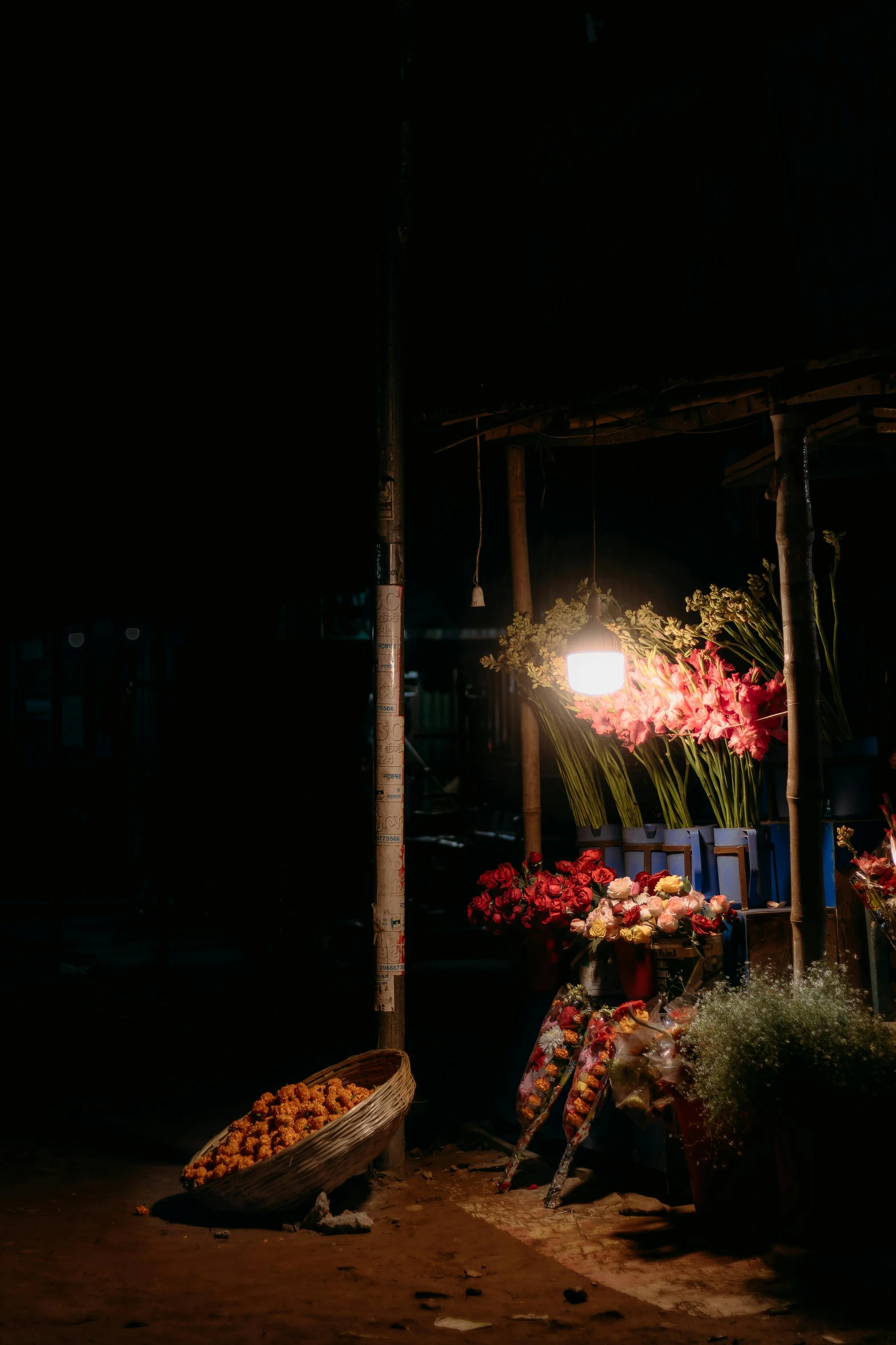 fruits and vegetables on display in a dark market