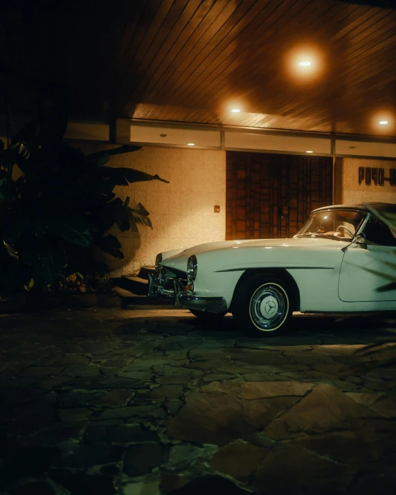 a car parked in front of a house at night