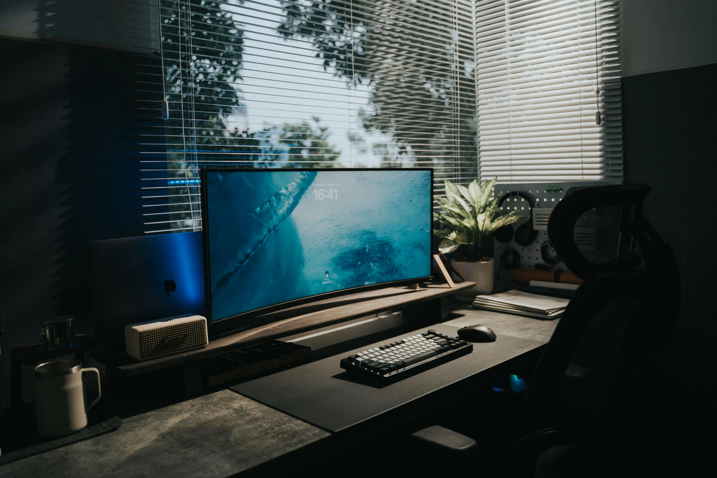 the monitor is on at a very well lit desk