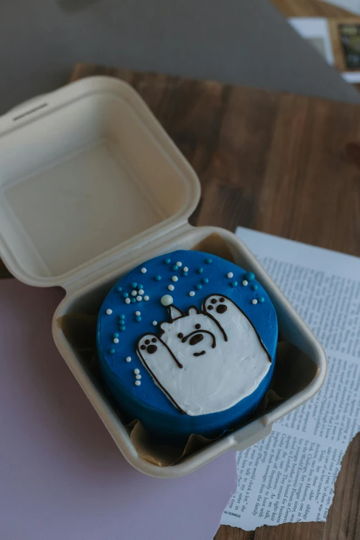 an odd shaped cookie that is sitting in a foam box