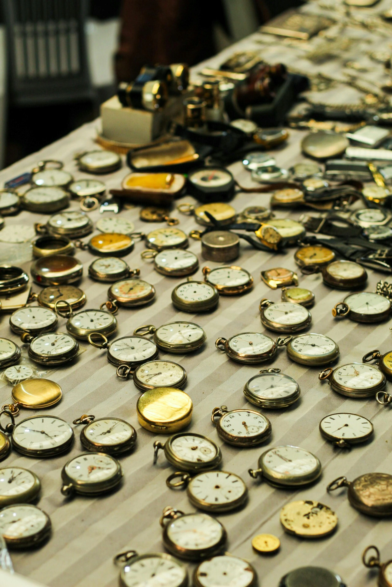 a table has many watches laying out on it