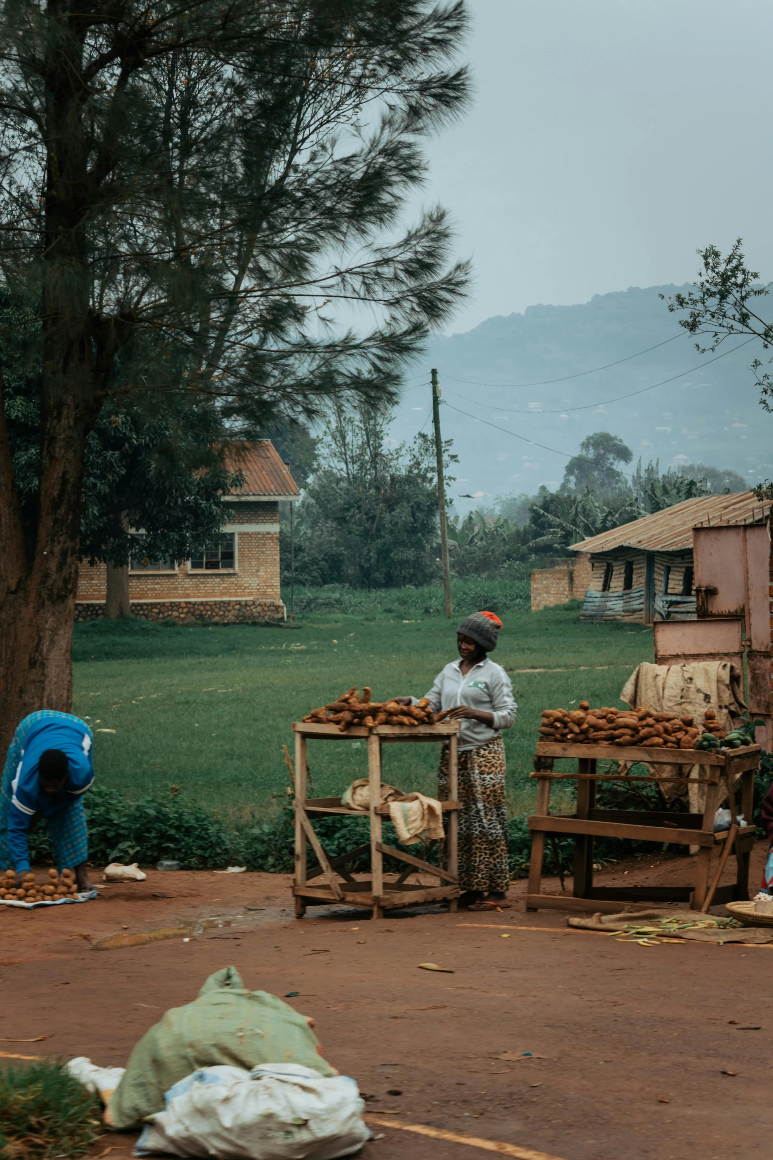 two men are working on crates outside