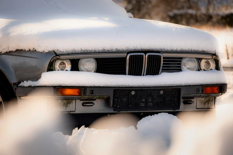 a po of a snow covered car that is looking very old