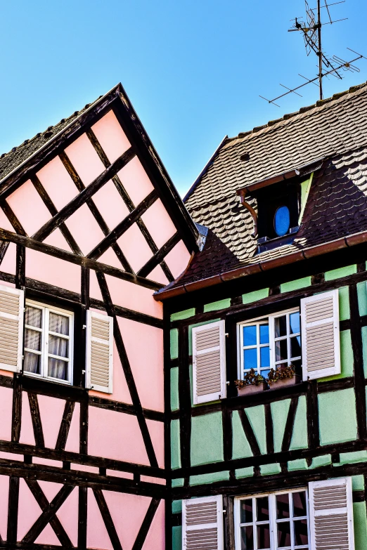 old buildings with white trim and blue windows