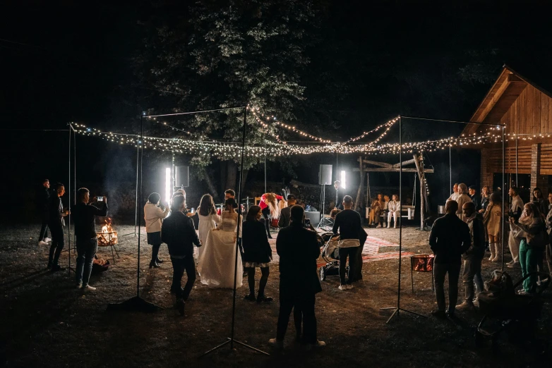 a group of people in line at a wedding