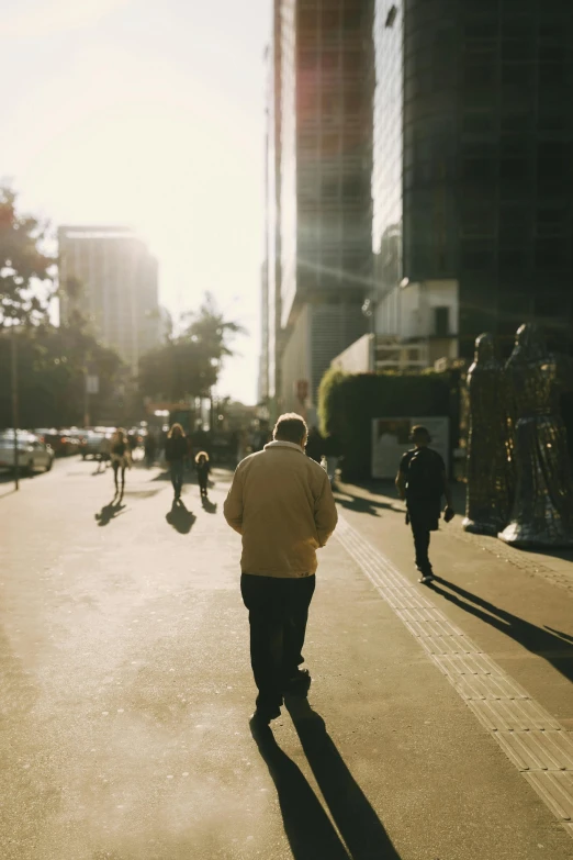 a man that is walking down the street