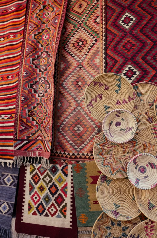 many rugs and other items in different colors