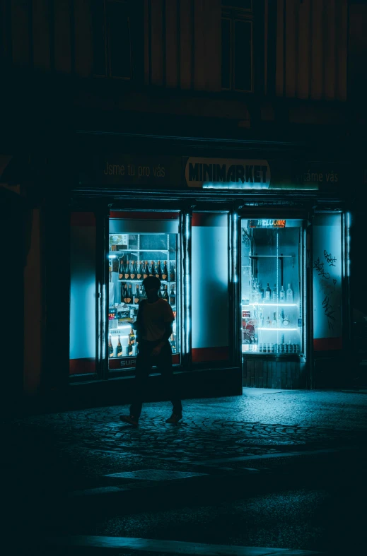 an empty storefront at night in the rain