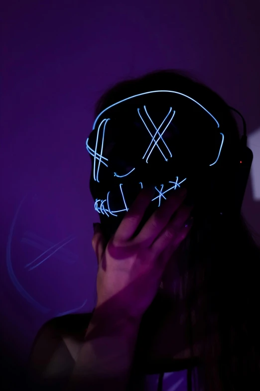 a woman with a neon mask on her head