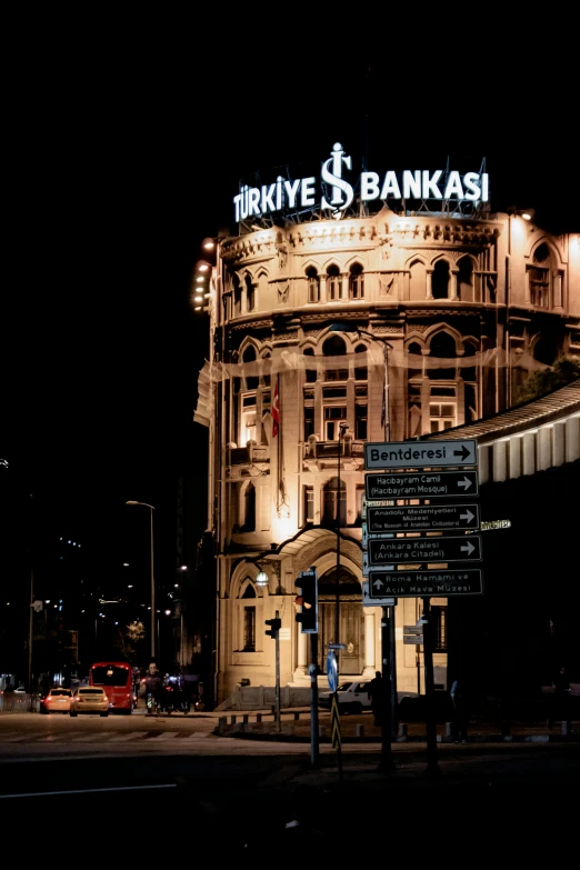 an old bank building in the city at night