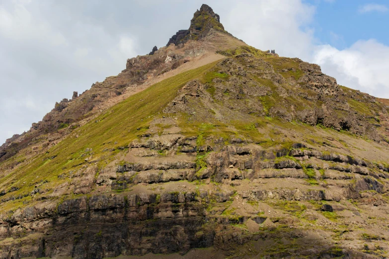 a view of a high mountain with rocky terrain