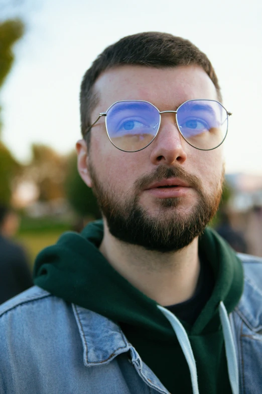 a close up of a person wearing glasses