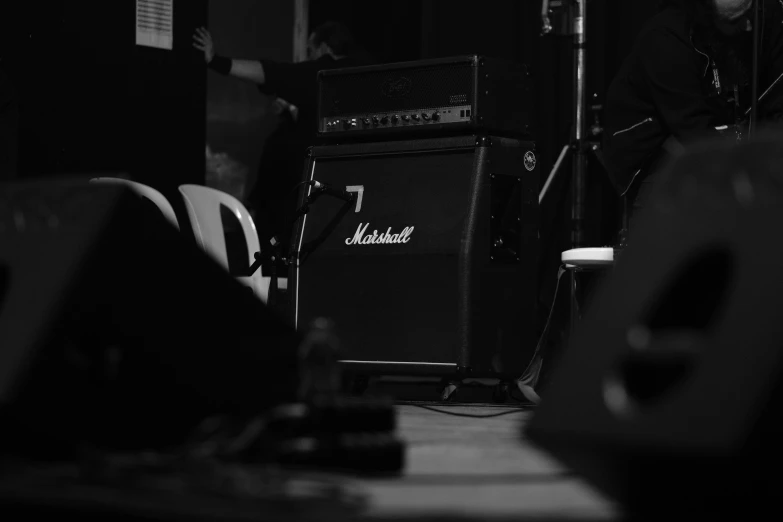 the amplifier is set on a table by the wall