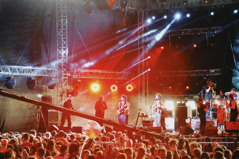 a large crowd of people watching two man perform