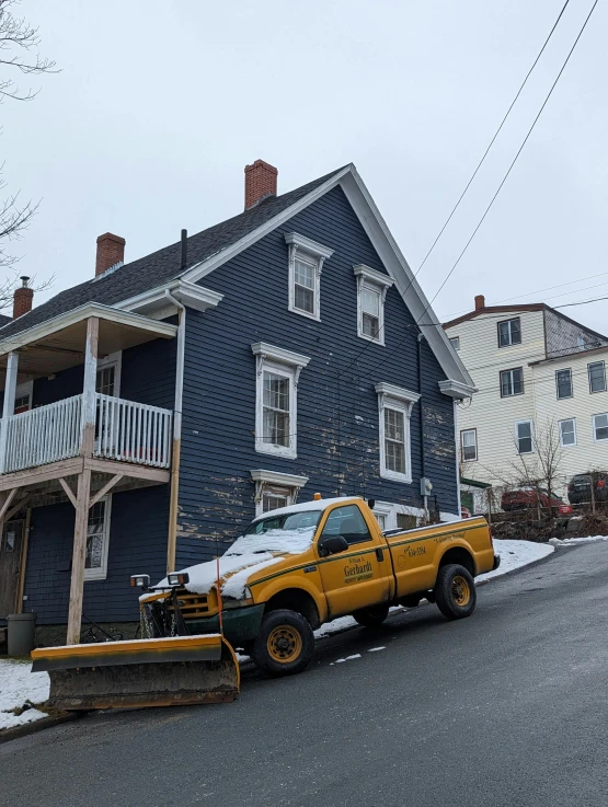 a truck with the bed down is parked on a street