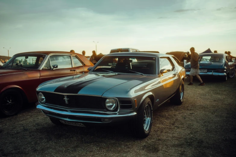 a group of cars parked at a car show