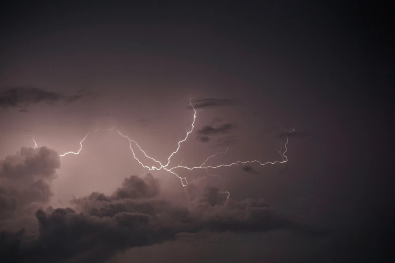 a group of storm clouds that have lightning