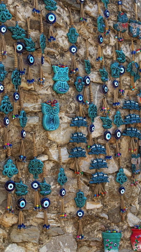 a group of blue ornaments on a rock