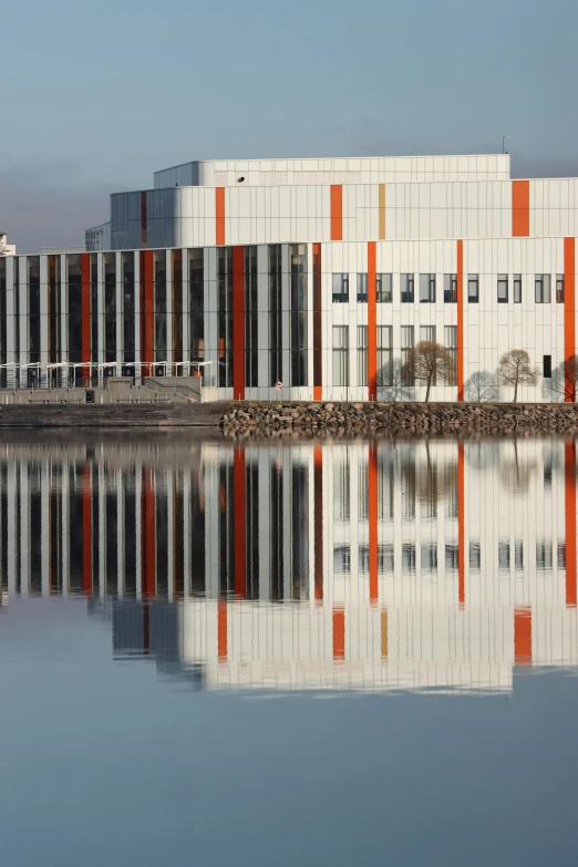 the orange stripes are reflecting in the water