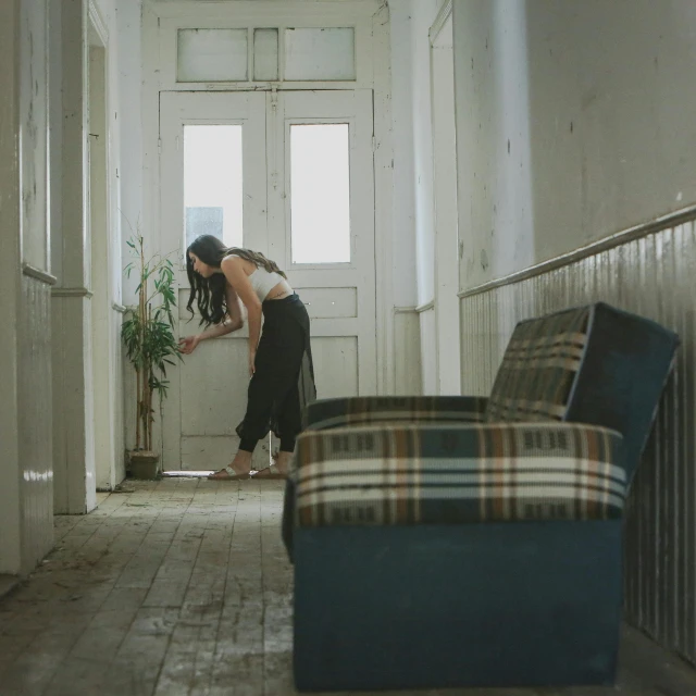 two women are walking down the hall way together