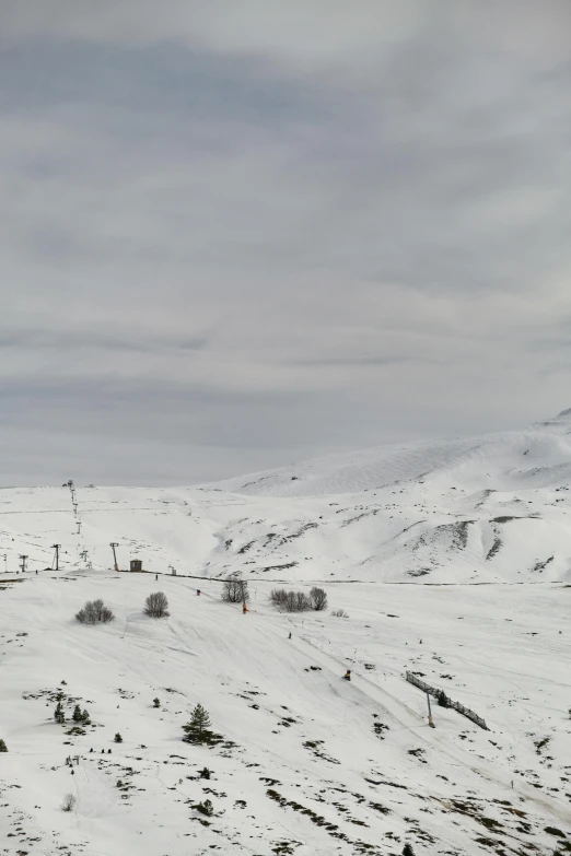 two people are skiing in the white snow