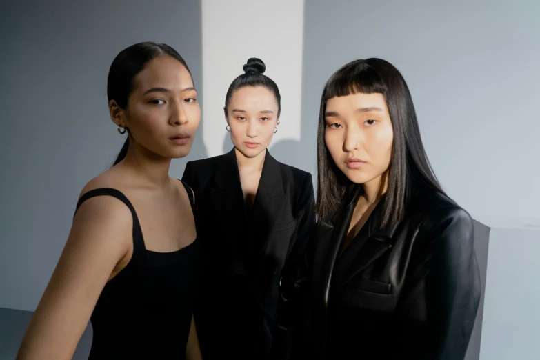 three female models posing together for a picture