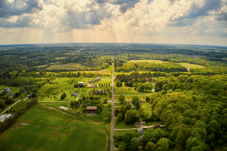 a rural area in the middle of green trees