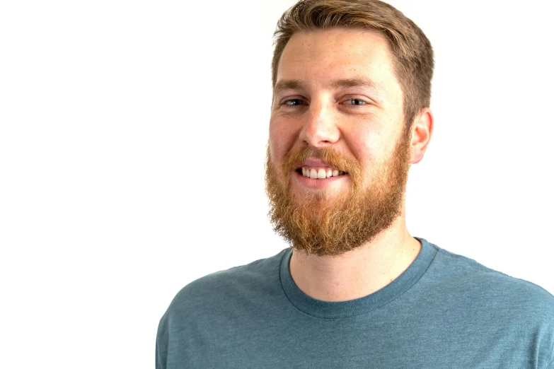 a man with a red beard is smiling